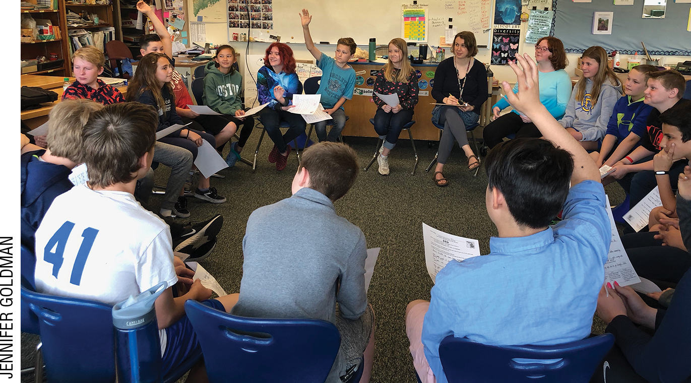 Photograph of a circle of students engaged in a lively philosophical discussion