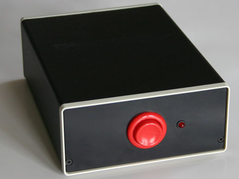 Photograph of a black box with a big red button in the center of it to illustrate PLATO's "Magic Box" lesson plan for elementary aged students