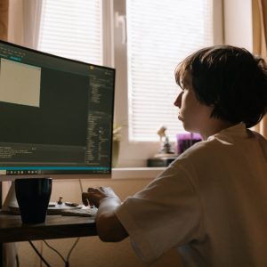 Boy working on computer